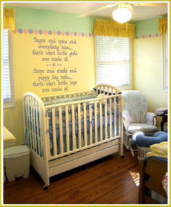 kid's wall lettering beside crib in baby's room 