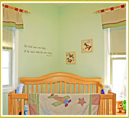 kids room decal on wall above crib in boy's nursery room