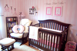 Mia's Room - A wall decal above the wooden Crib in a nursery room.