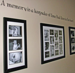 A wall decal with collage of pictures on the hallway -A memory is a keepsake of time that lives in the heart