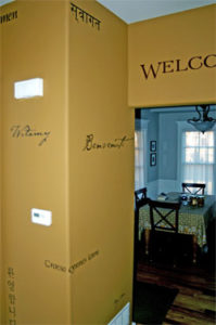 Welcome, wall decal facing the dining room with an earth-color design motif of the interior