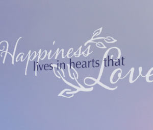 Happiness lives in hearts that love Wall Decal