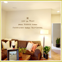 inspirational wall lettering decal above sofa in sitting room