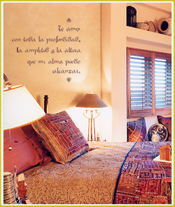style wall lettering decal above bedside lamp in Southwestern bedroom