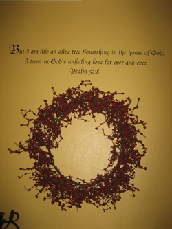 A bible scriptures wall words with ornamental garland on the center