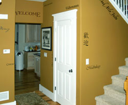 Multi-Lingual Welcome-wall lettering on the wall in the hallway.
