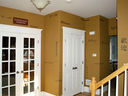 Wall words near the entrance door, along the hallway and on the stairway wall