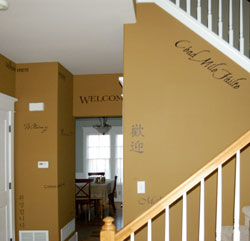 Wall words near the entrance door, along the hallway and on the stairway wall